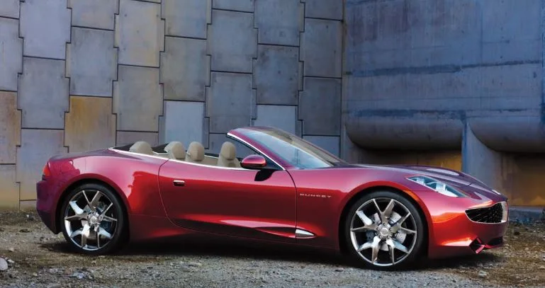 Red Fisker Sunset plug-in hybrid convertible shown with retractable hardtop stowed