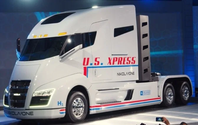 Finished Nikola One hydrogen-electric semi show truck cab on stage at its public debut