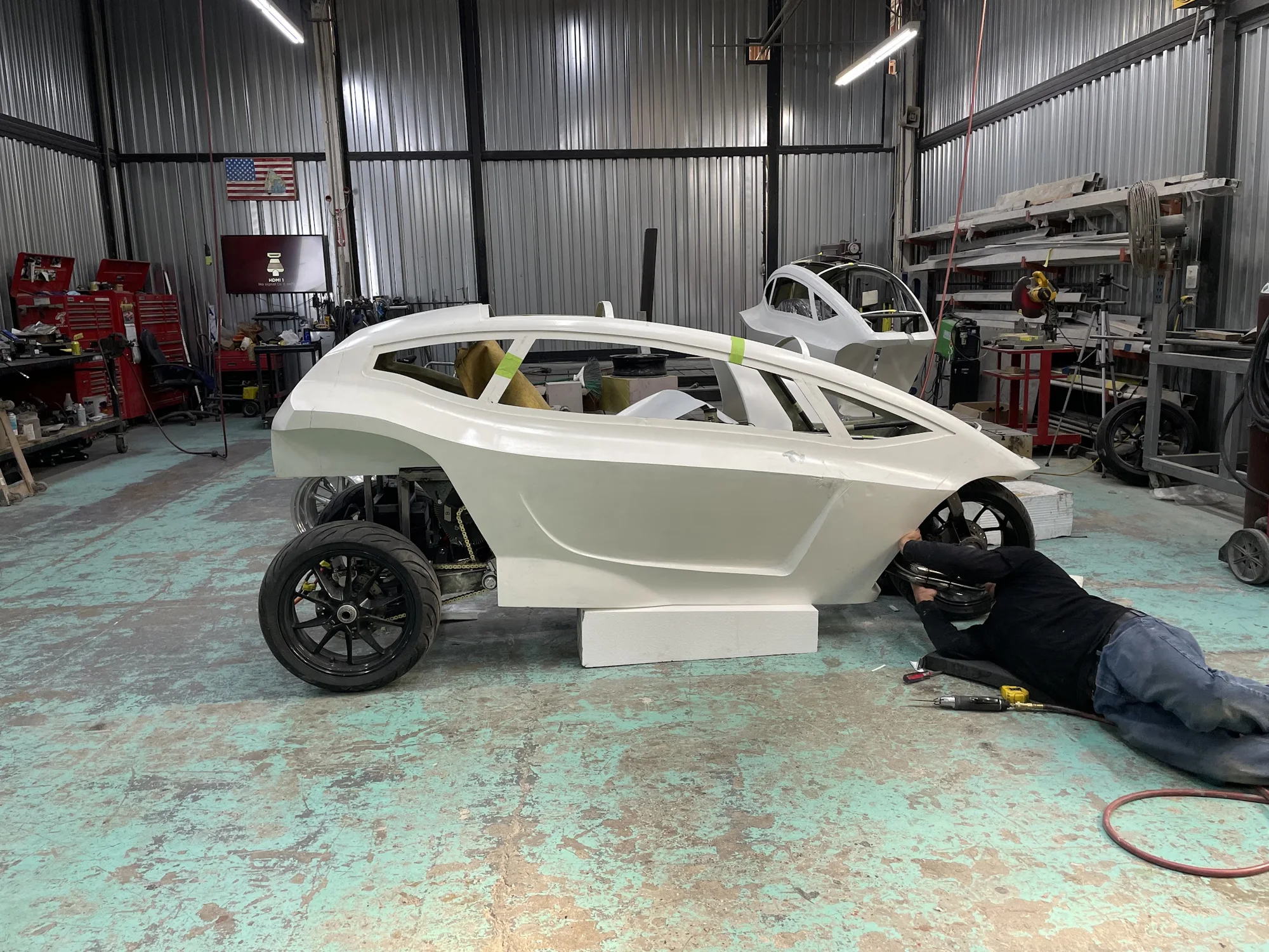 Step 6: Trinova prototype body and EV chassis systems under hands-on assembly in the workshop