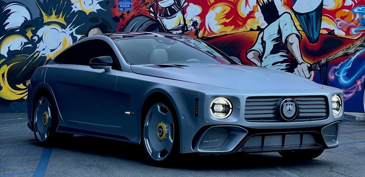 Finished WILL.I.AMG grand touring coupe parked in front of a colorful mural wall
